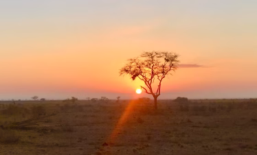 Sunset over the Tsavo East plains during a 2-day safari from Mombasa or Diani