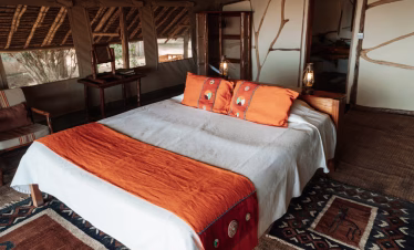 Elegant safari tent interior at Satao Camp with full-board service in Tsavo East