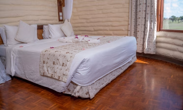 Inside view of a luxury room at Salt Lick Safari Lodge with panoramic wildlife views