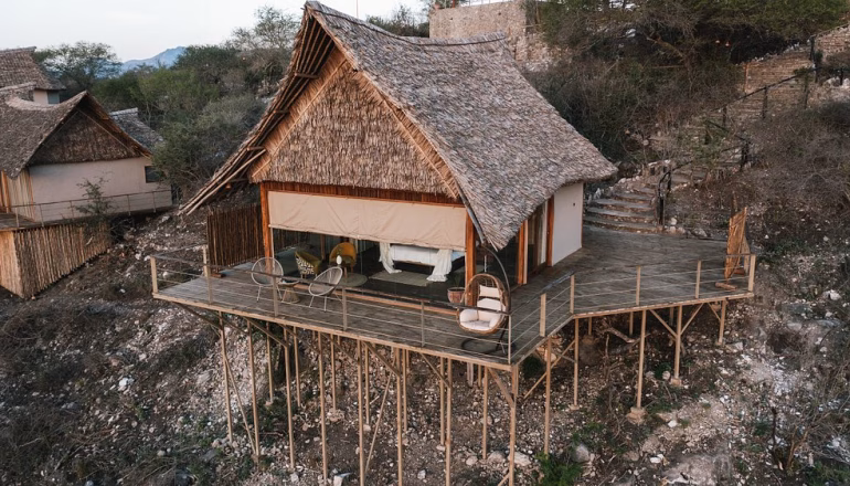 Scenic safari lodge in Kenya overlooking wildlife plains - top accommodation for Tsavo and Amboseli safari tours